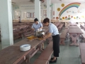 Co Chua and Co Kee giving a helping hand in preparing the food..jpg